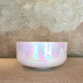 Load image into Gallery viewer, Iridescent crystal sound bowl on a textured surface with a neutral background