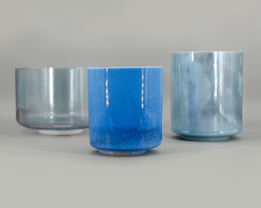 Ethereal Twilight Full Set of three crystal sound bowls with blue glaze on a gray background
