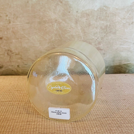 Clear Crystal Sound Bowl with a Crystal Tones label on a textured surface
