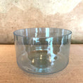 Load image into Gallery viewer, Clear crystal sound bowl on a textured surface

