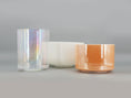 Load image into Gallery viewer, Three crystal sound bowls in different colors on a gray background
