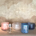 Load image into Gallery viewer, Set of five metallic-colored Crystal Sound Bowls on a textured surface with a neutral background
