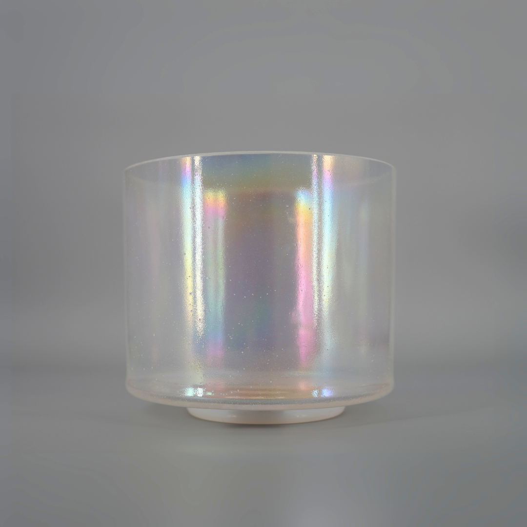 Iridescent crystal sound bowl on a gray background