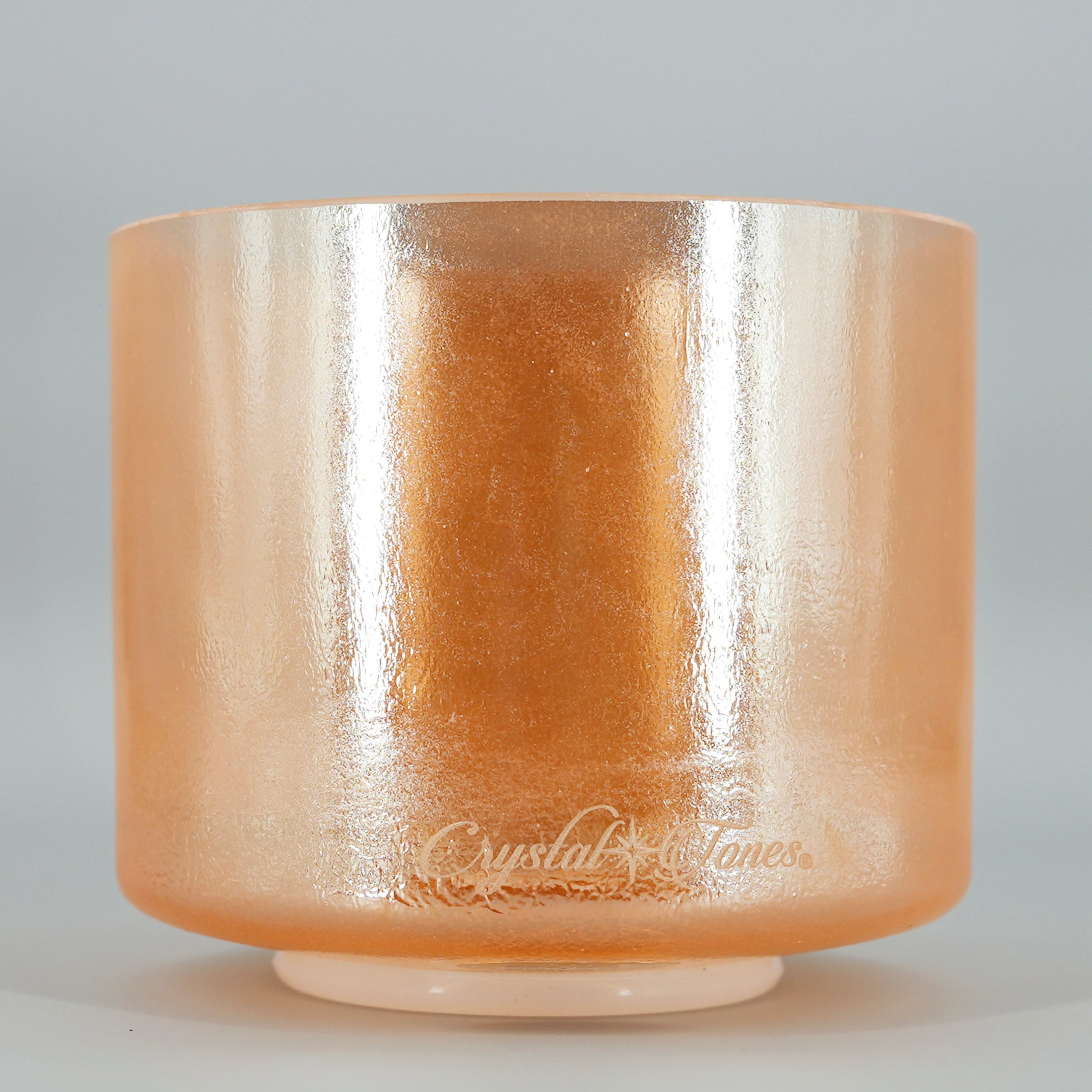 Orange crystal sound bowl with 'Crystal & Tones' branding on a gray background
