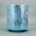 Load image into Gallery viewer, Blue crystal sound bowl with marbled pattern on a gray background
