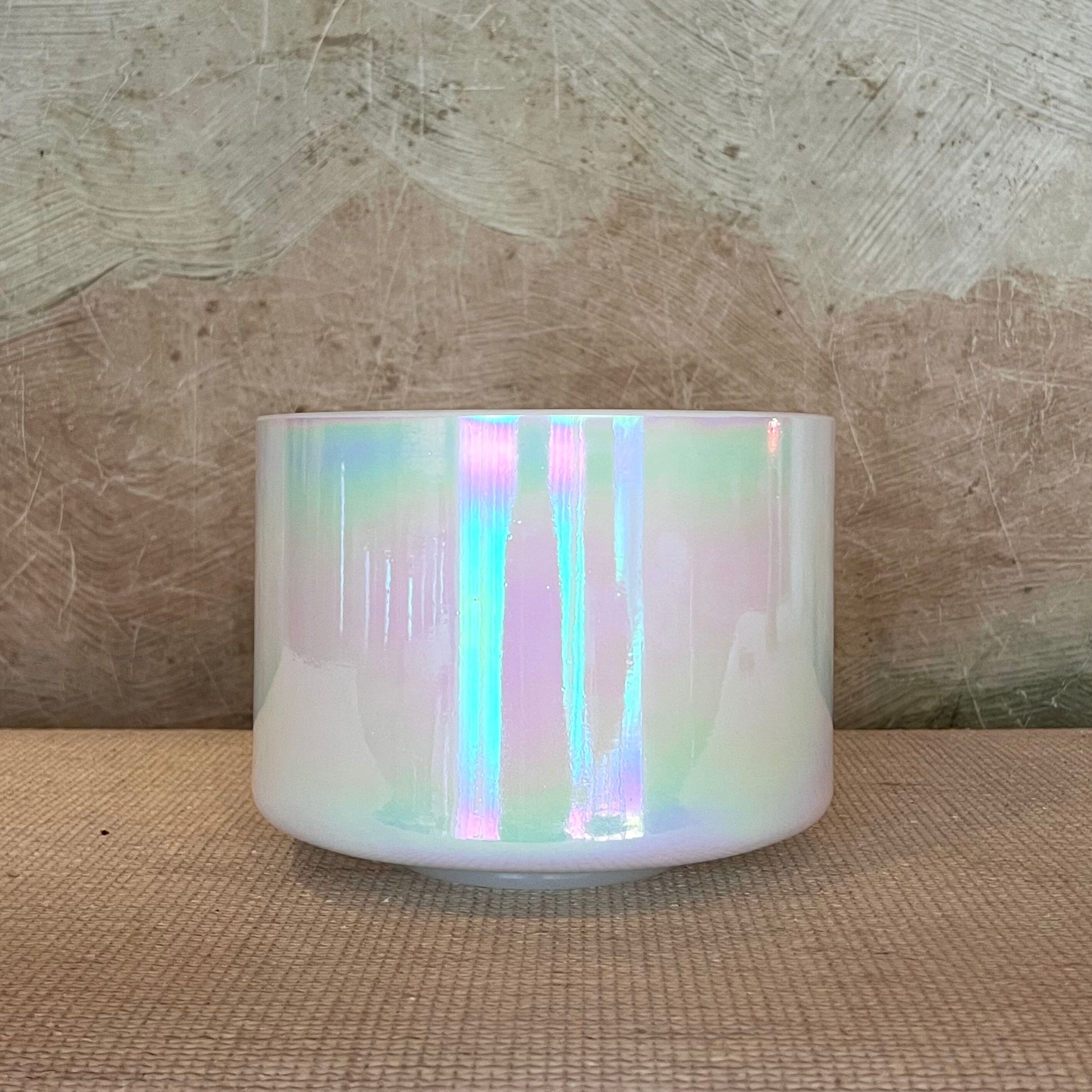 Iridescent Crystal Sound Bowl on a textured surface