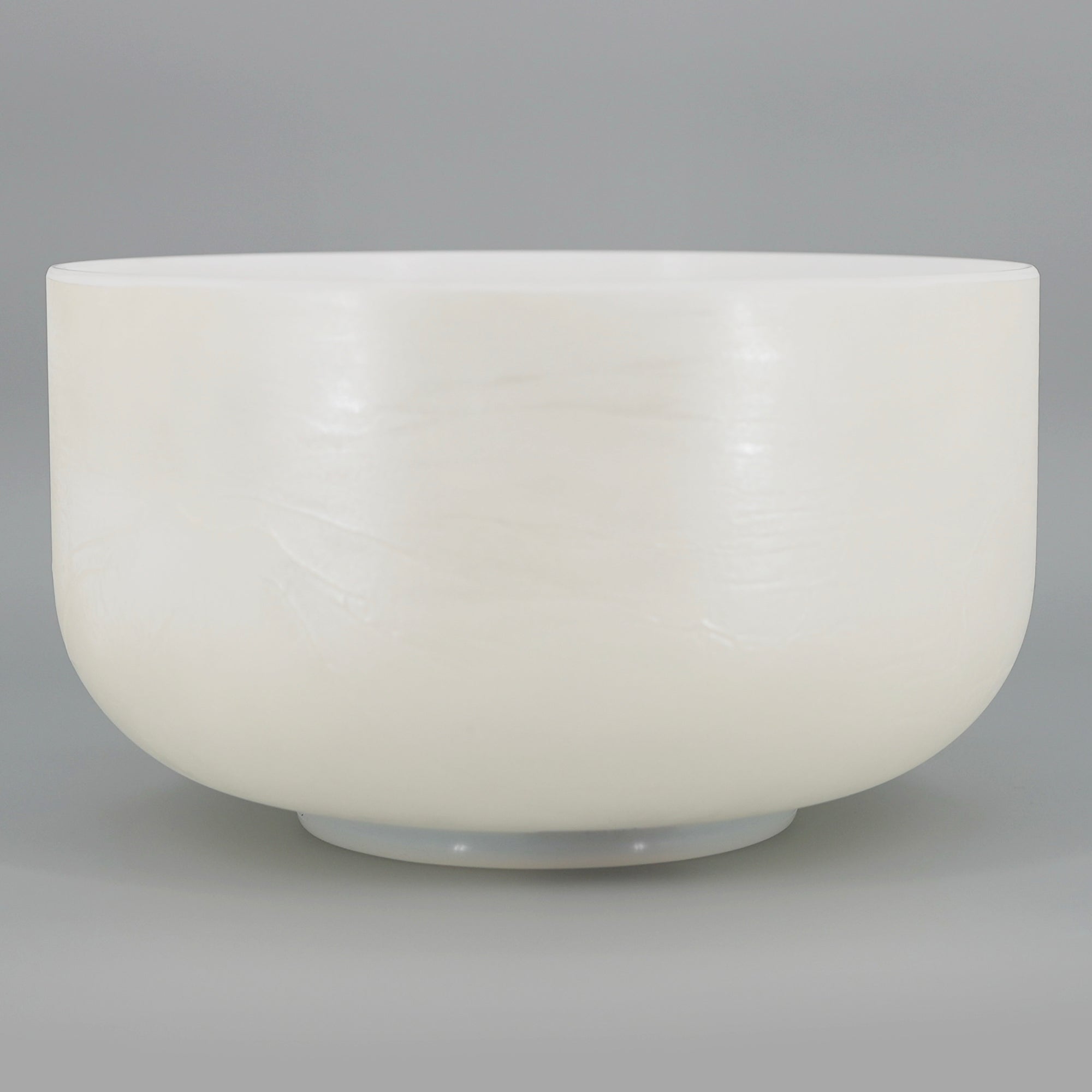 White Crystal sound bowl on a gray background