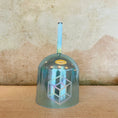 Load image into Gallery viewer, Metallic blue crystal sound bowl with geometric design on a textured surface
