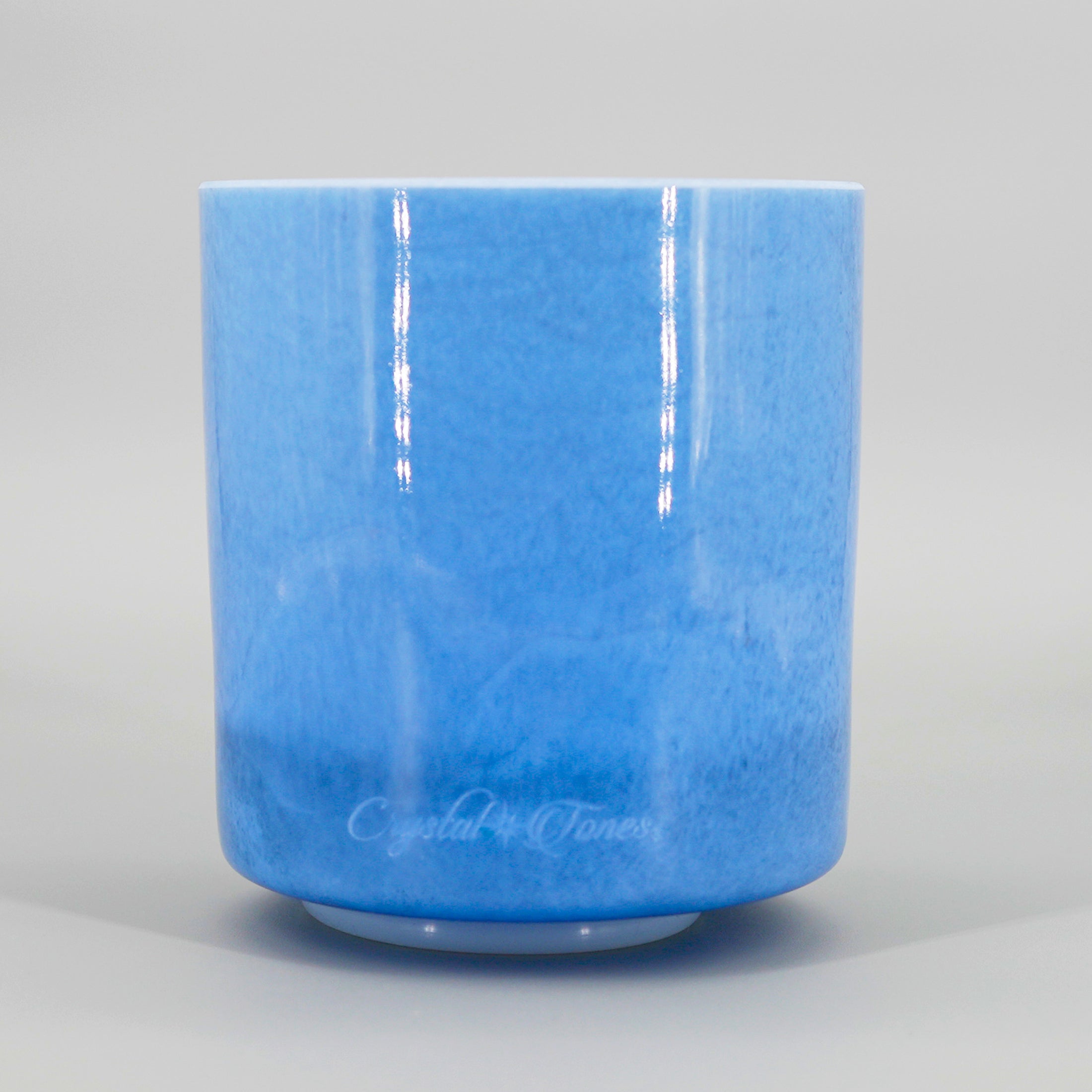 Blue crystal sound bowl with 'Crystal Tones' branding on a gray background