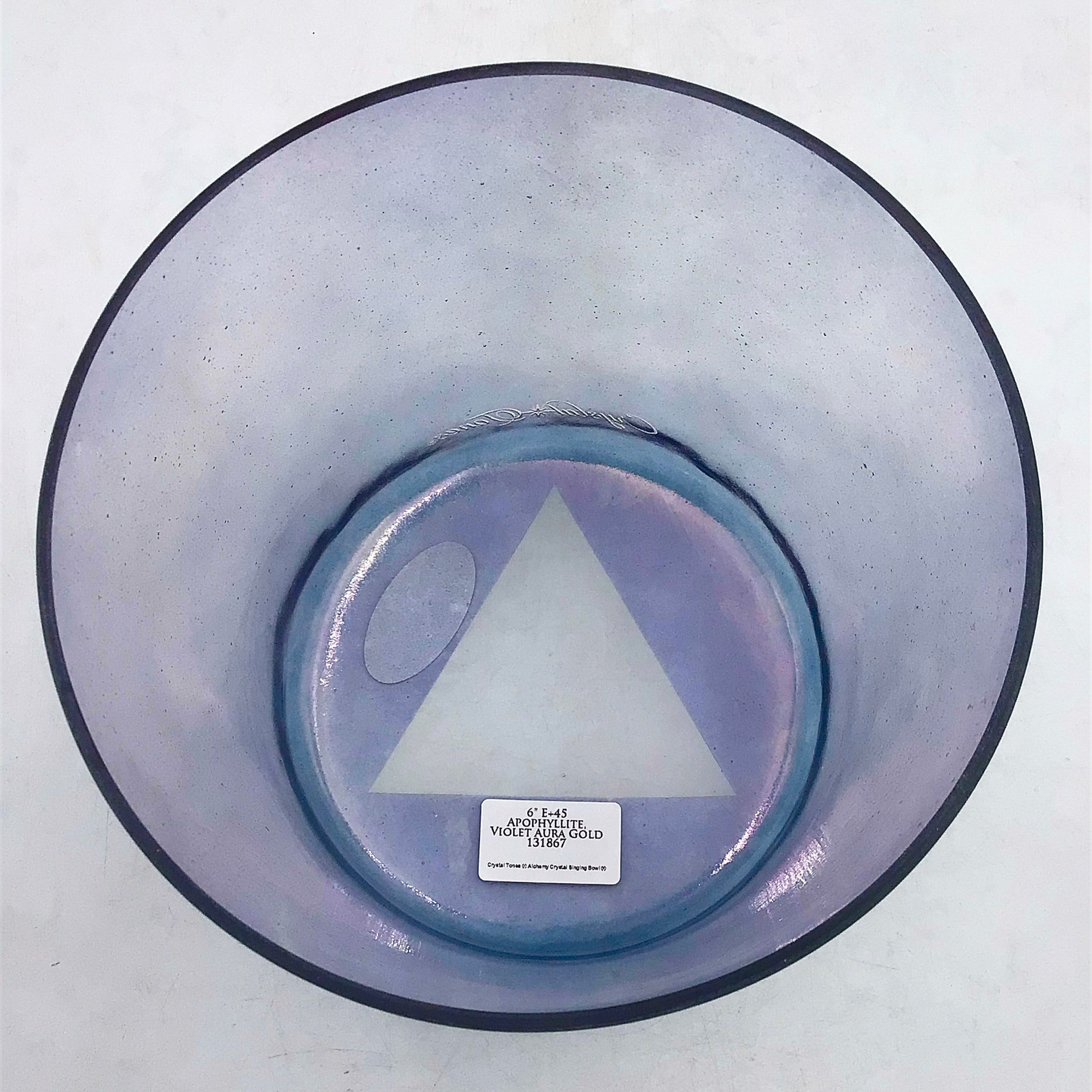 Round crystal sound bowl with a visible brand label on a white background