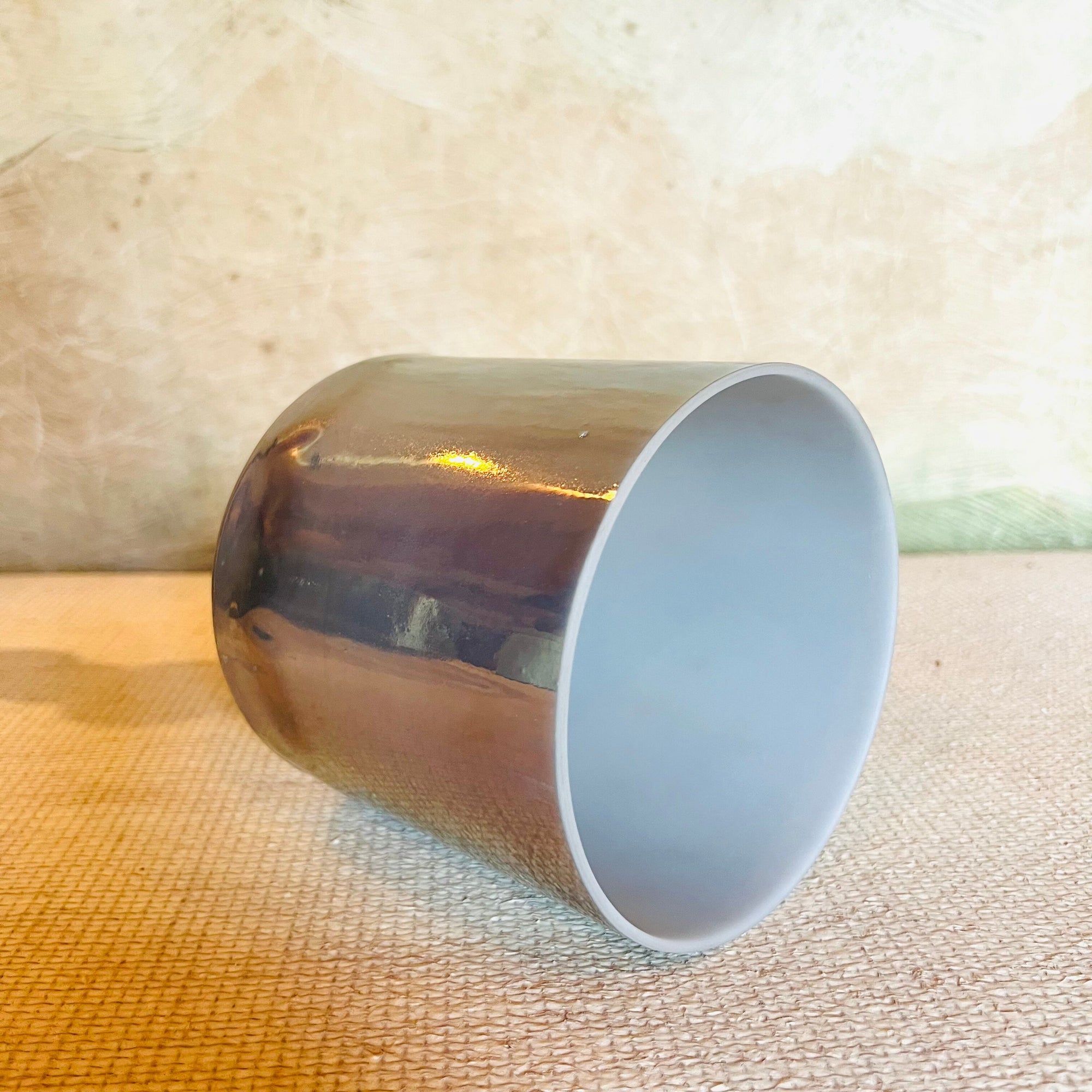 Metallic Crystal Sound Bowl on a textured surface