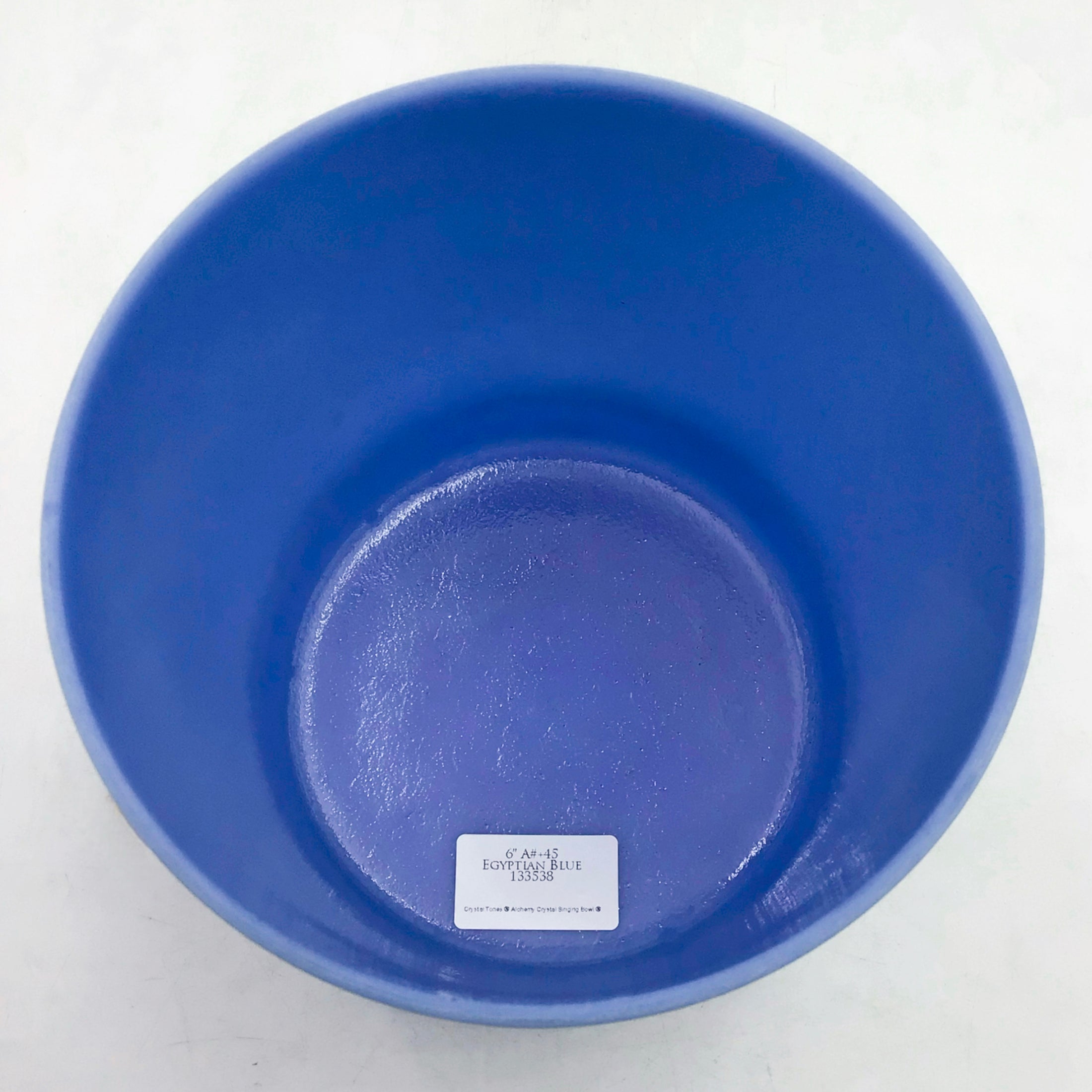 Blue crystal sound bowl on a white background