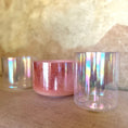 Load image into Gallery viewer, Iridescent crystal sound bowls on a textured surface with a blurred background
