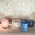 Load image into Gallery viewer, Set of colorful Crystal Sound Bowls on a textured surface with a neutral background
