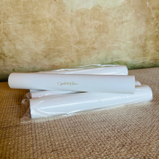 White sonic mallets with 'Crystal Tones' branding on a textured brown surface